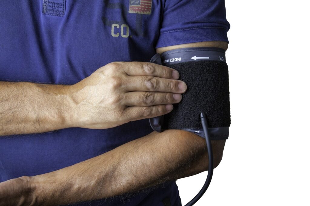 doctor using equipment to monitor vital signs